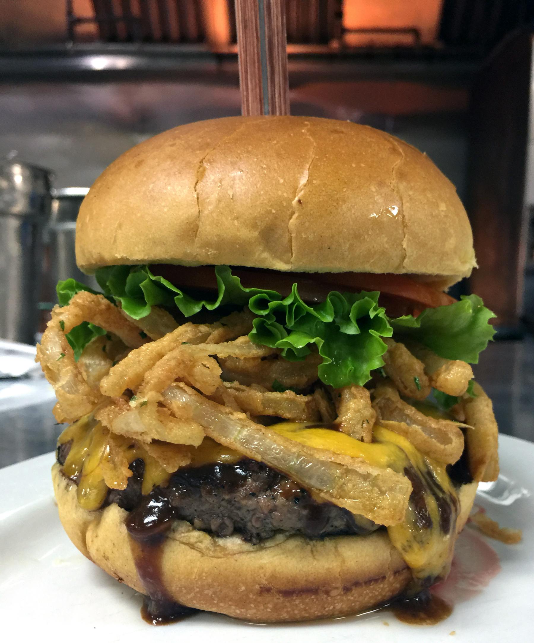 a sandwich with lettuce and fries on a plate